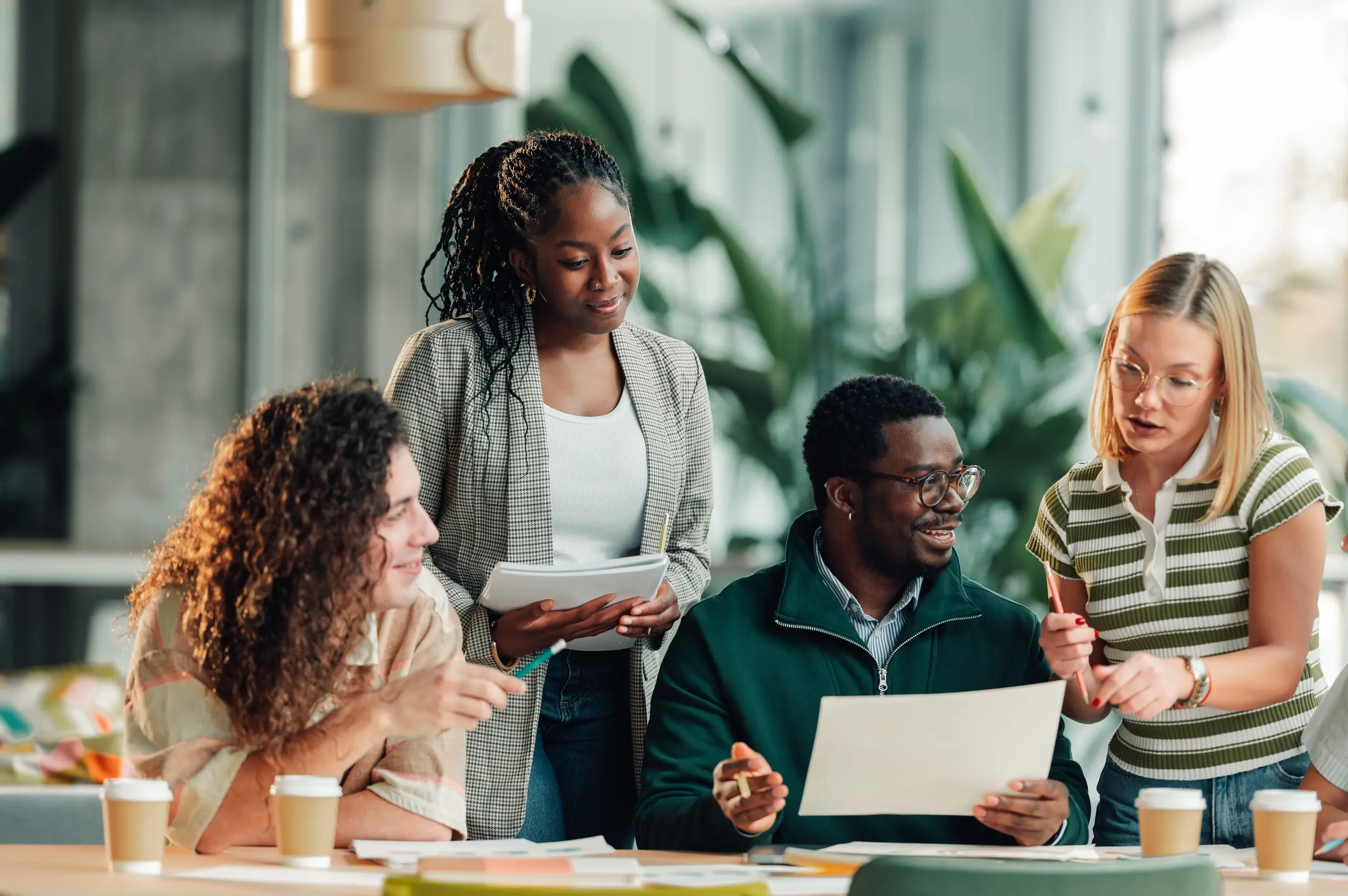 A team collaborating around a table in a bright office